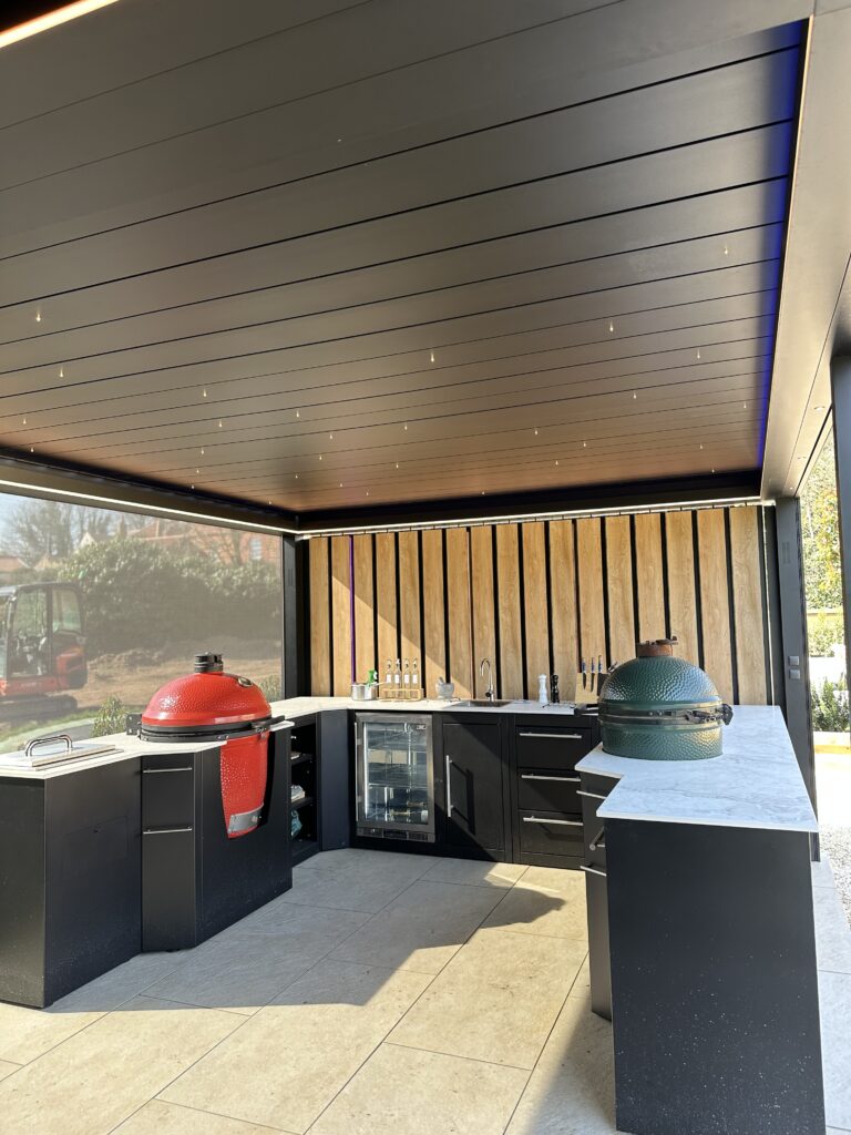 closed pergola with outdoor kitchen