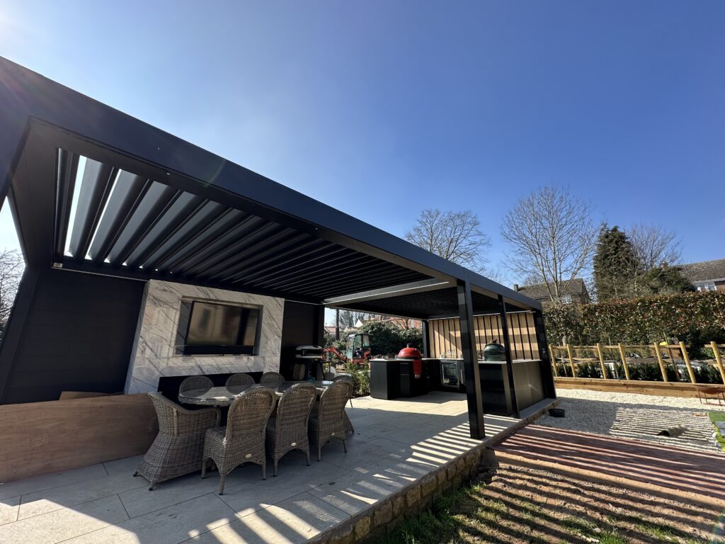extra large pergola with outdoor kitchen and media wall